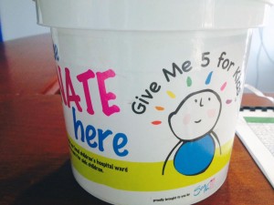 SeaFM office donation bucket.